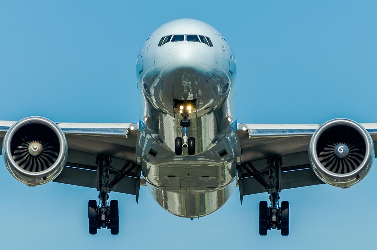 Front view of a commercial aircraft on the ground